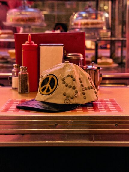 SATOSHI NAKAMOTO STUDDED WRAP AROUND LEATHER CAP